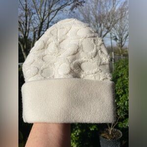 White Textured Beanie by Coach.
NWOT